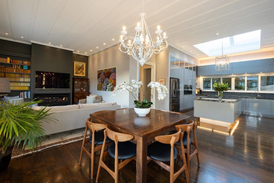 Open plan living area with chandelier and recessed lighting